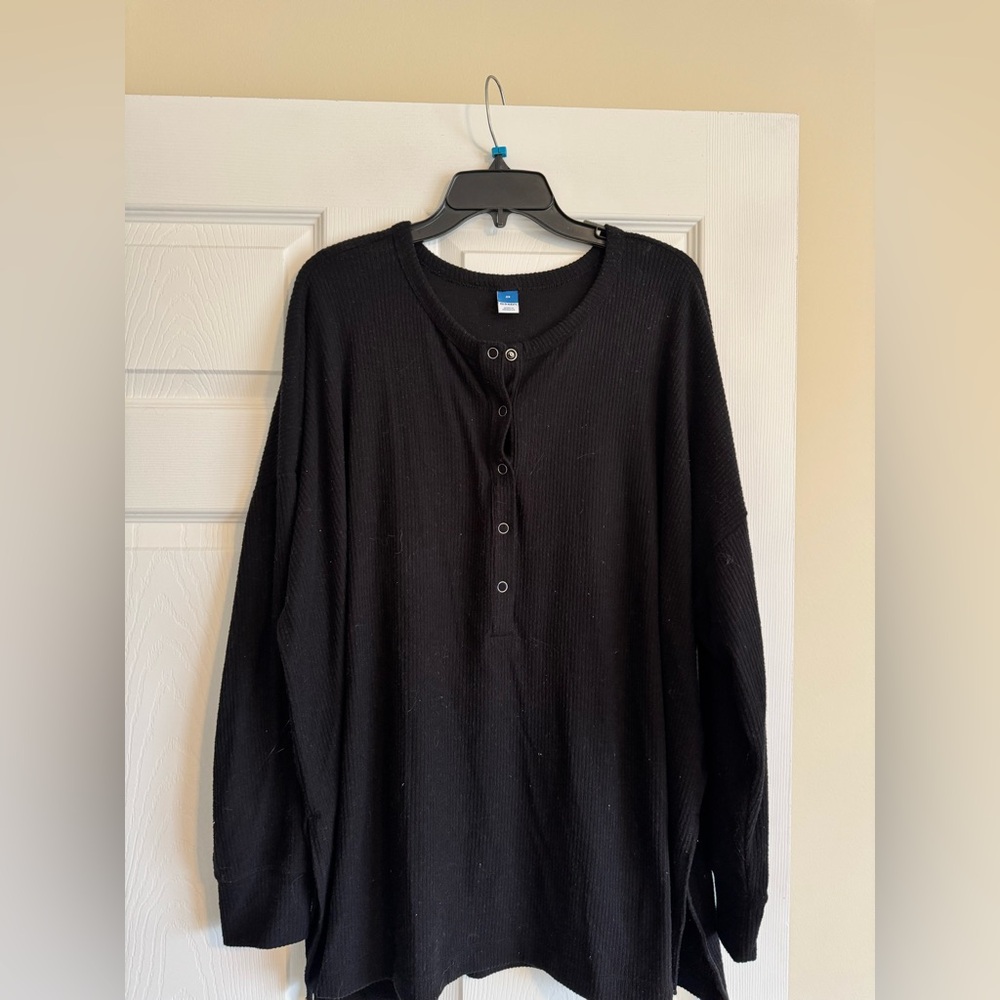 Women’s black ribbed long sleeve quarter button down top, slits on the sides
